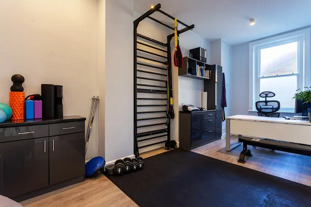 Treatment room with physiotherapy bed and equipment