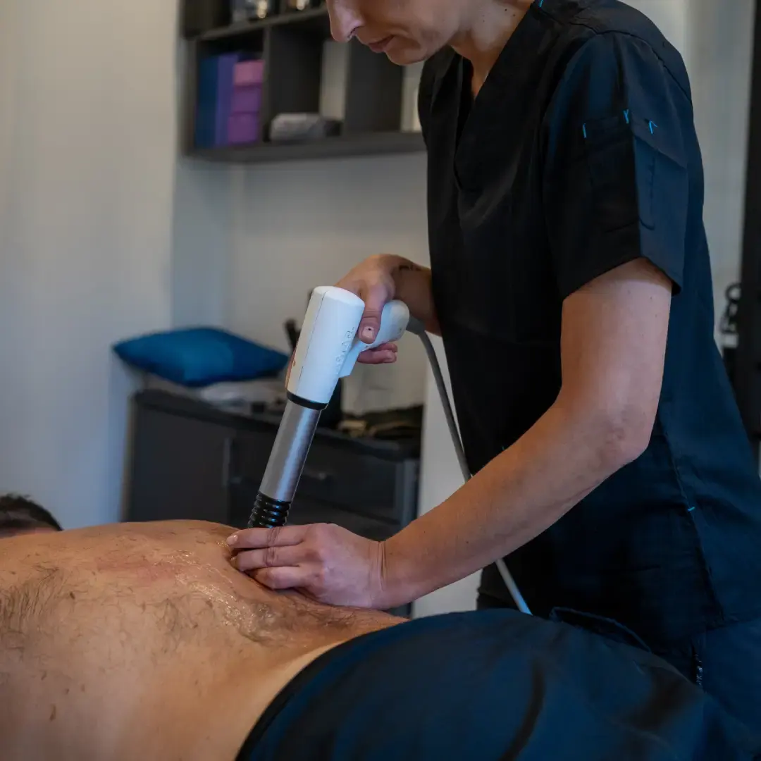 Patient receiving shock wave therapy in London Ealing at PhysioB